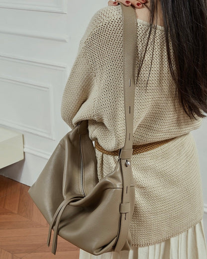 Women's Genuine Pebbled Leather Crescent Bag with Tassel Accent