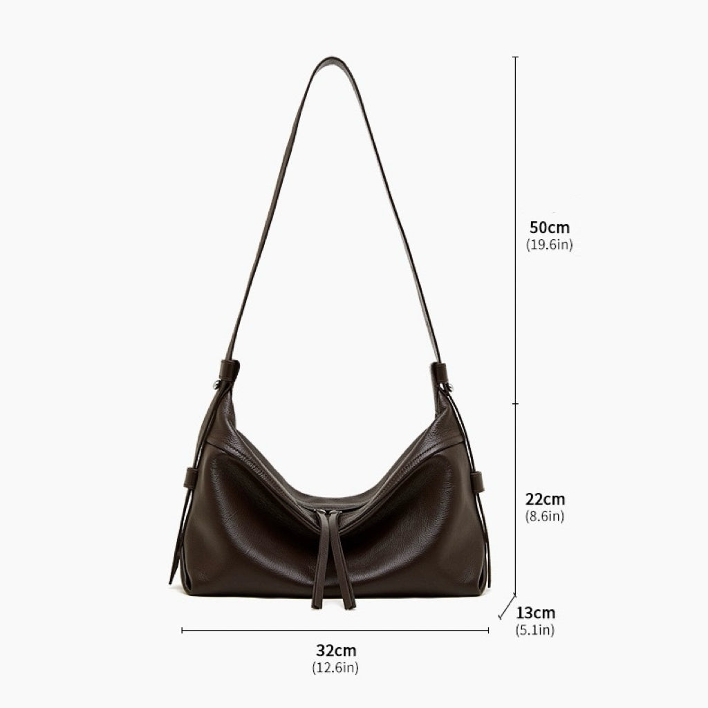 Women's Genuine Pebbled Leather Crescent Bag with Tassel Accent