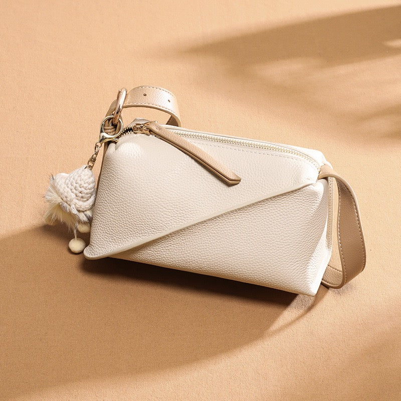 Elegant Geometric Genuine Leather Crossbody Bag with Plush Charm