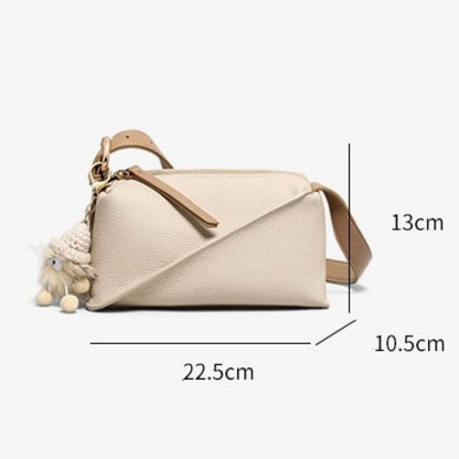 Elegant Geometric Genuine Leather Crossbody Bag with Plush Charm